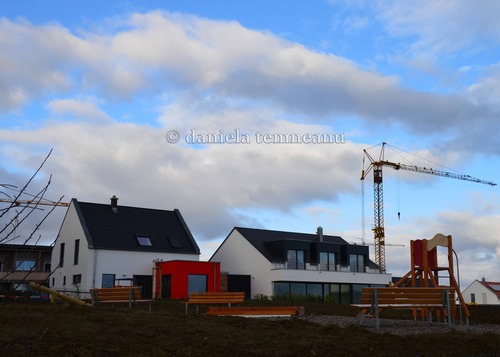 Product picture building new houses in a suburban neighborhood perfect for f