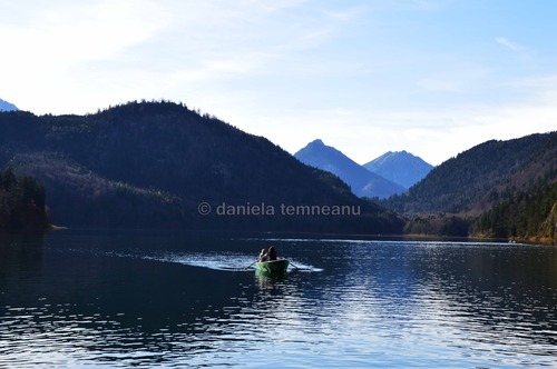 Product picture young women in a boat on lake Alpsee, Germany